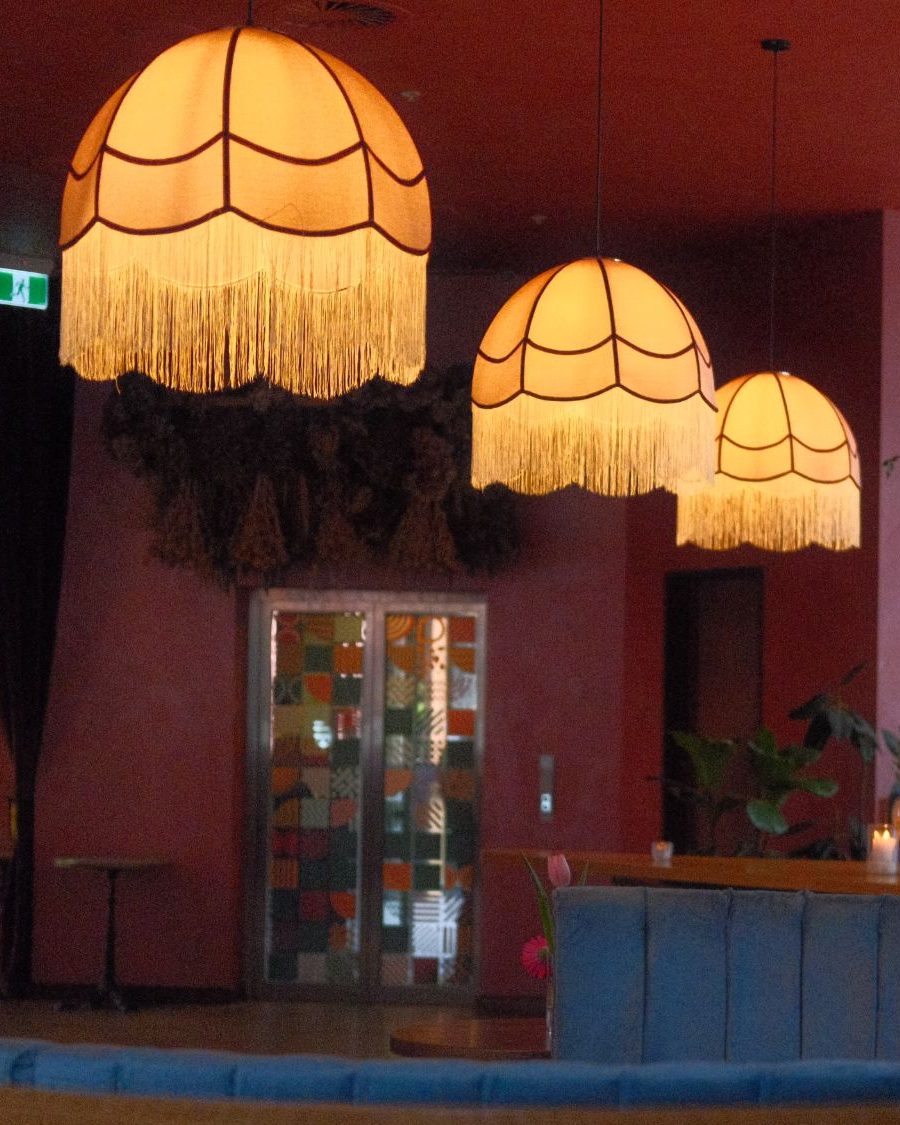 Fringed lamps, dried flowers and rose plaster walls in the Negroni lounge
