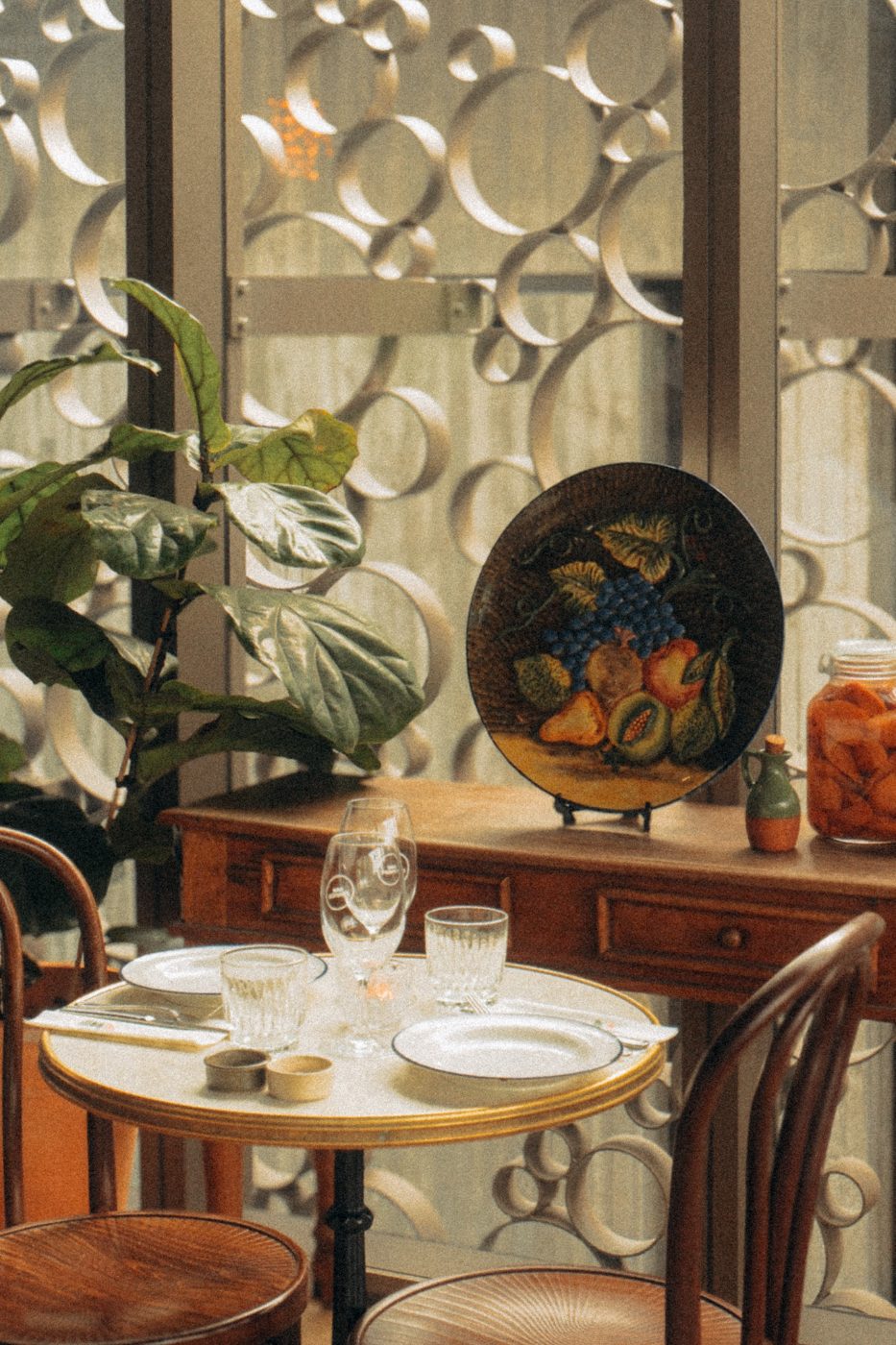 An intimate marble bistro table set for two at Bar Franco