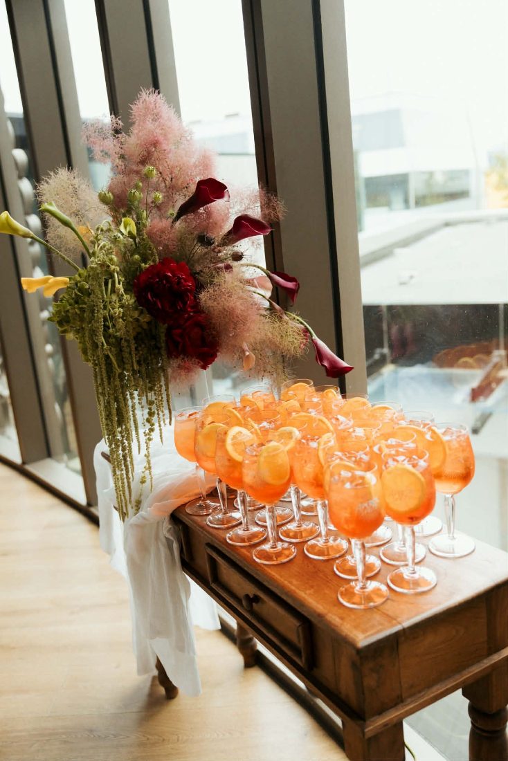 Rows of spritzes and flowers waiting for the guests