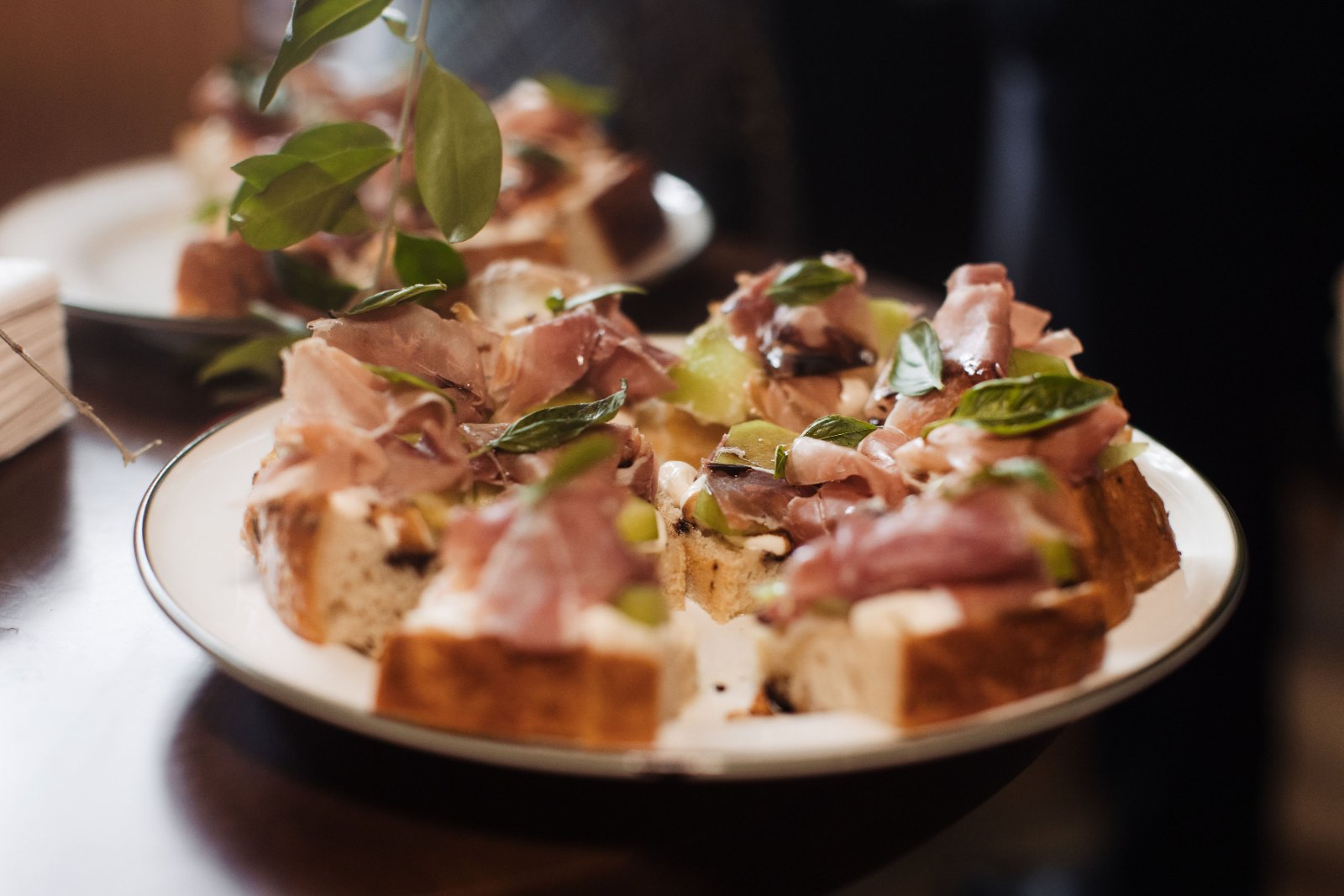 Crostini with prosciutto, passed on a tray