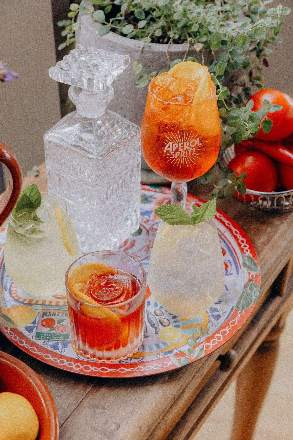 A tray of spritzes and a decanter for the toast