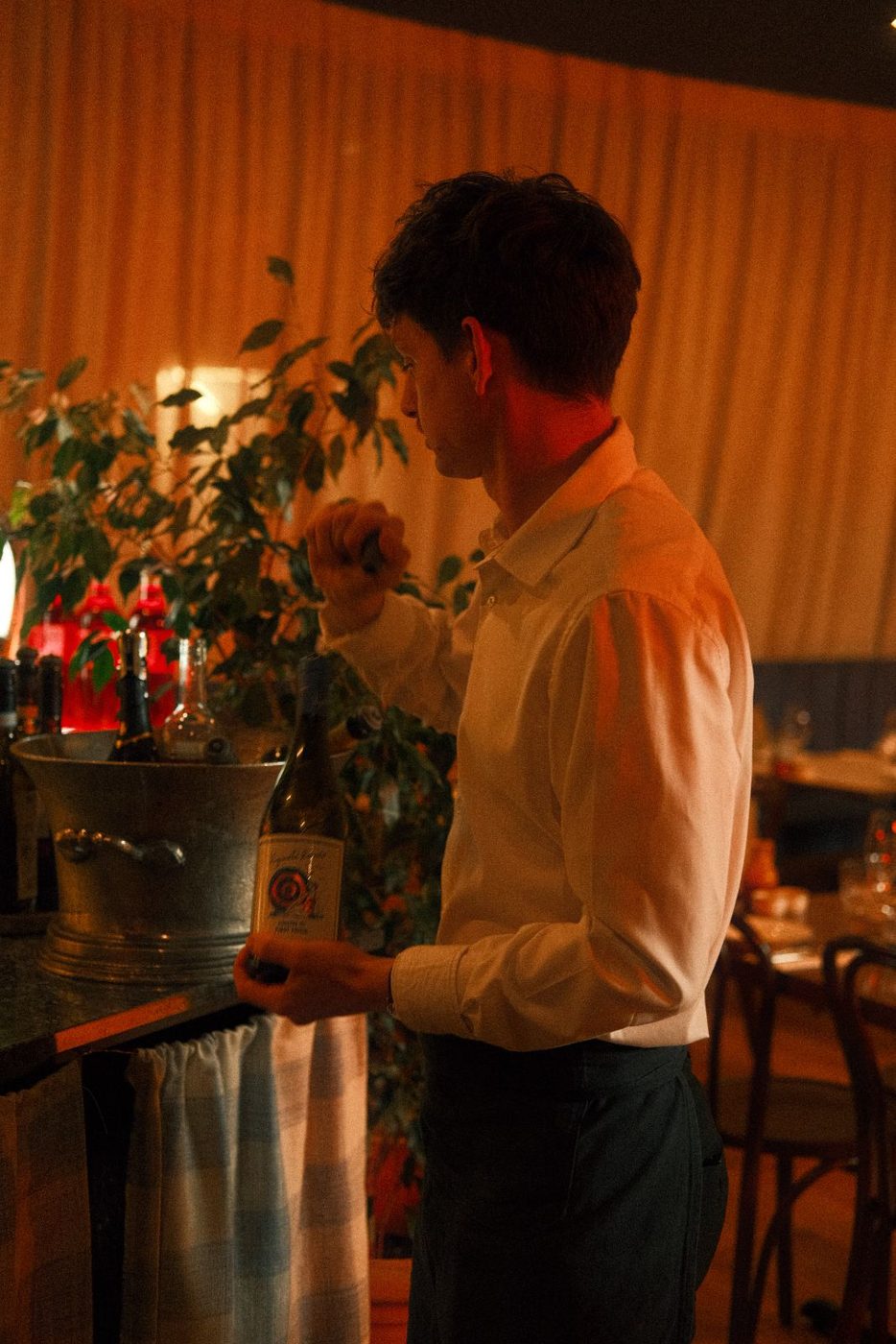 A glass of wine poured at the table