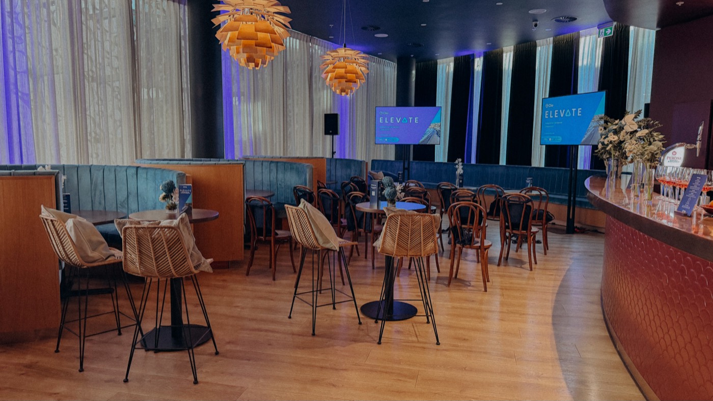 The Level 1 bar set with high tables and stage lighting for a corporate function