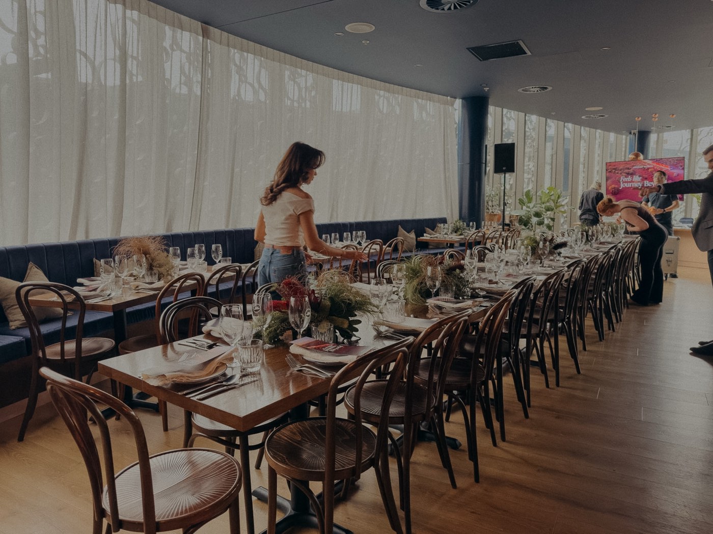 The Level 2 restaurant set with long tables for a corporate event at Bar Franco