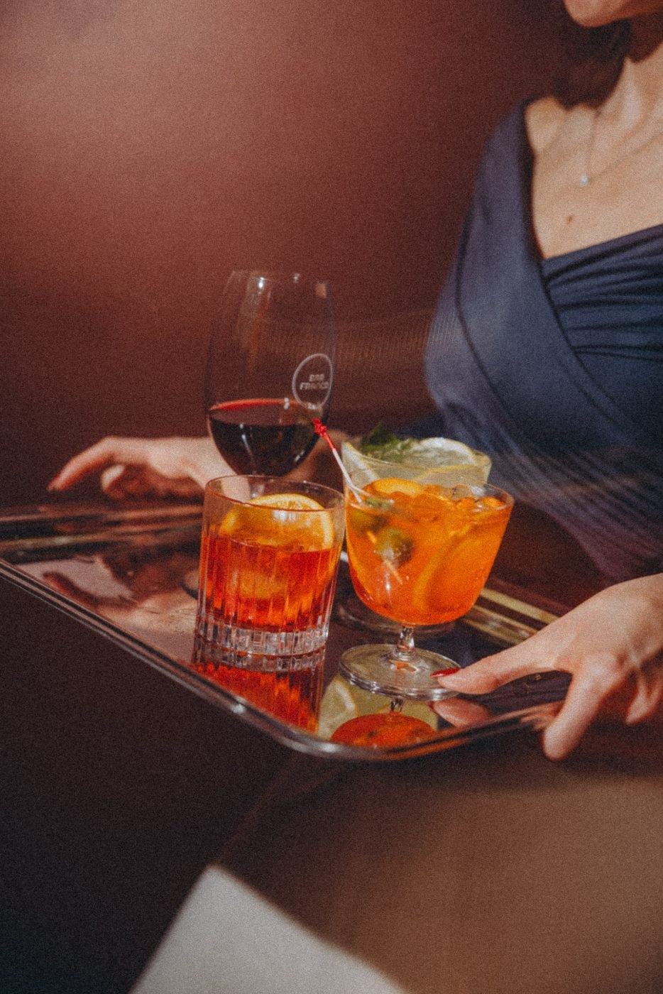A tray of Negronis carried through the bar