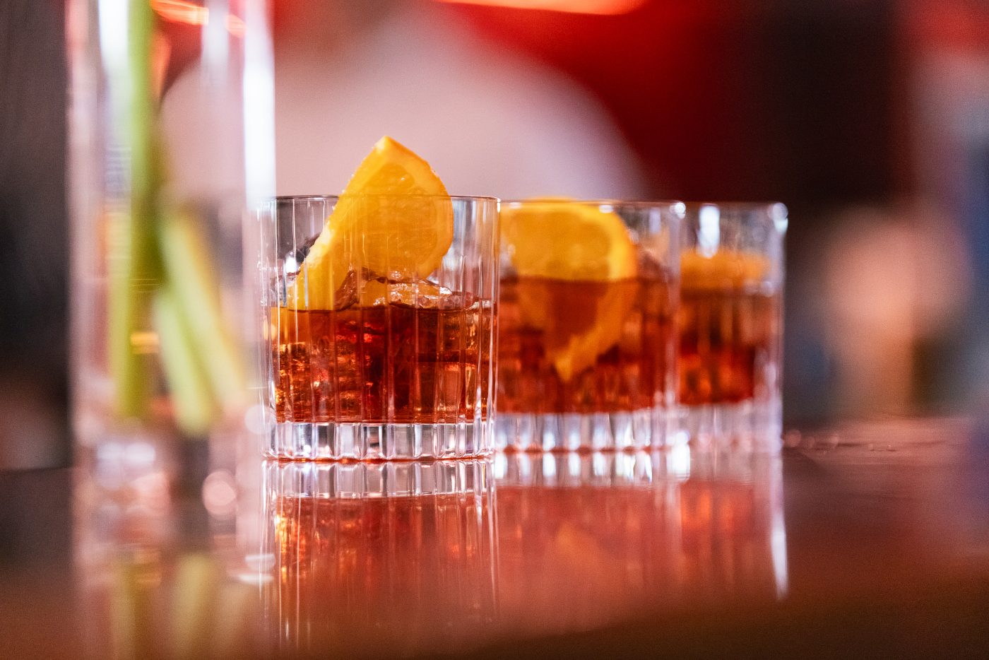 A bartender pouring spritzes at the Negroni & Spritz Bar