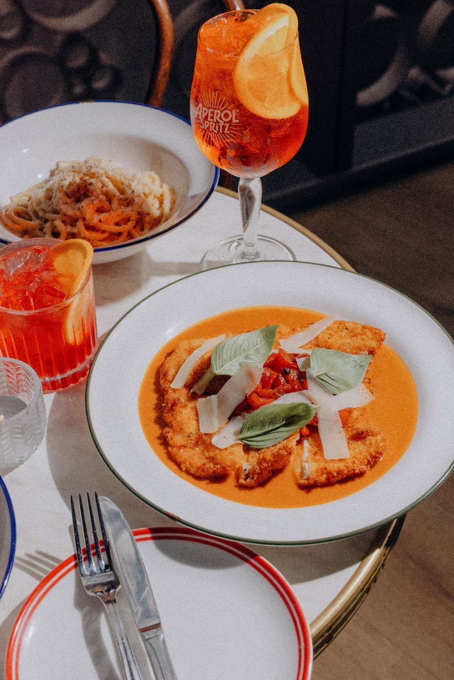 Chicken parmigiana with an Aperol spritz at Bar Franco