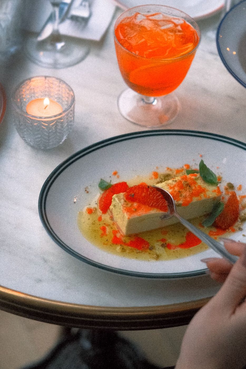 Dessert and a spritz by candlelight